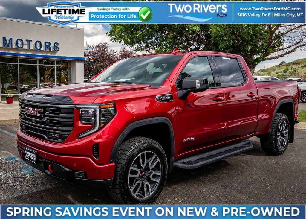 2025 GMC Sierra 1500 AT4 in Volcanic Red Tintcoat — front three-quarter view