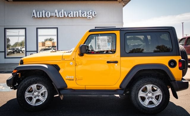 2019 Jeep Wrangler Sport S in Yellow — front three-quarter view
