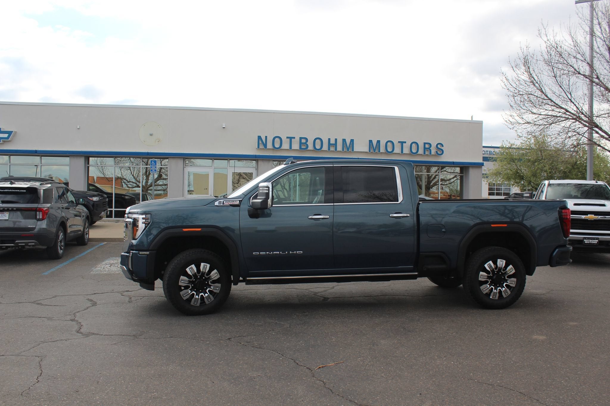 2025 GMC Sierra 3500 HD Denali in Downpour Metallic — front three-quarter view