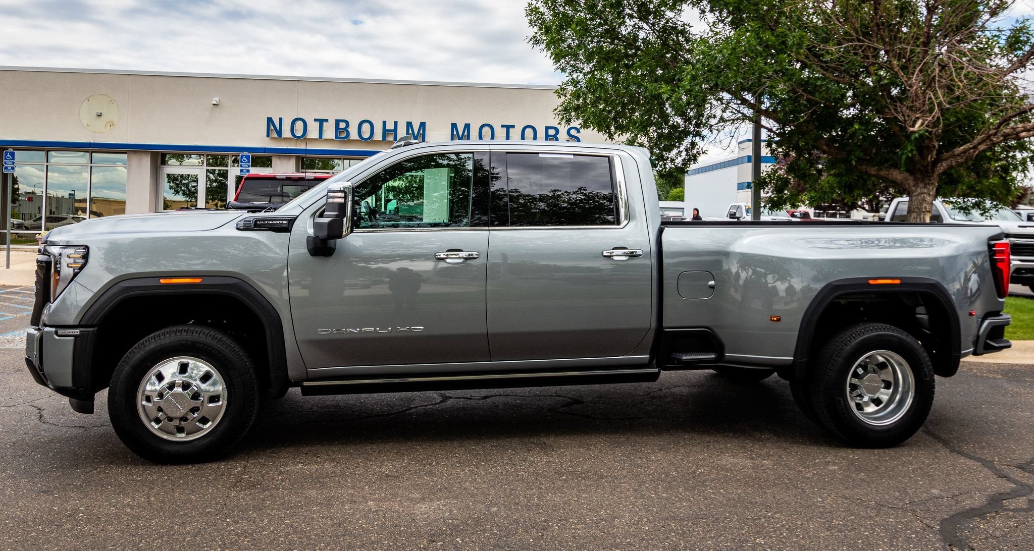 2025 GMC Sierra 3500 HD Denali Ultimate DRW in Sterling Metallic — front three-quarter view