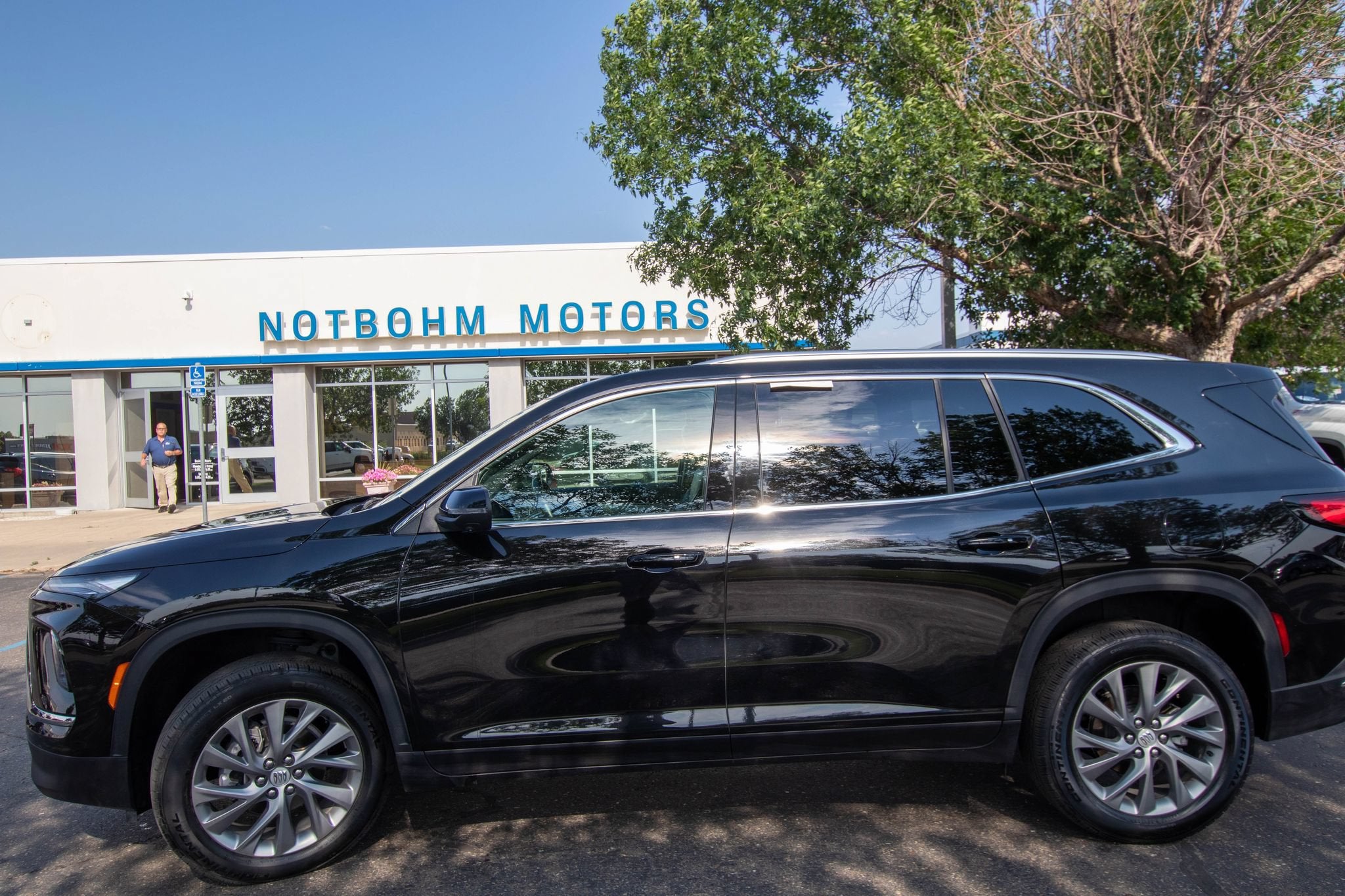2025 Buick Enclave Preferred in Ebony Twilight Metallic — front three-quarter view